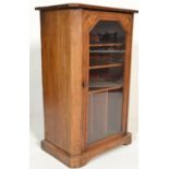 A 19th Century Victorian walnut inlaid pier - pedestal music cabinet having plinth base with glass