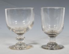 Two 19th century Georgian rummer glasses to include a glass having a round foot with knopped stem