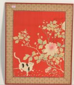 An early 20th century Burmese needlepoint on silk tapestry with cat and peony tree set on red silk