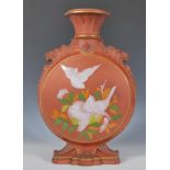 A 19th Century Victorian Watcombe Torquay terracotta moon flask, the central round body decorated