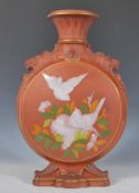 A 19th Century Victorian Watcombe Torquay terracotta moon flask, the central round body decorated