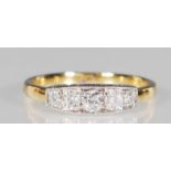 An 18ct yellow gold Art Deco style ring having a decorative white gold mount set with five