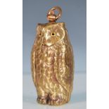 A brass sovereign / coin case in the form of an owl, having a hinge opening with compartments to the
