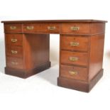 A Victorian 19th century twin pedestal walnut and leather office desk. Each pedestal raised on