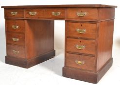 A Victorian 19th century twin pedestal walnut and leather office desk. Each pedestal raised on