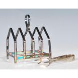 A mid 20th Century silver hallmarked toast rack having pointed sections with a loop handle to the