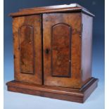 A 19th Century Victorian walnut veneered specimen chest / cabinet raised on a plinth base with