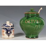 A 20th Century studio pottery terracotta olive jar finished with a green glaze, of bulbous