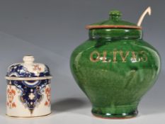 A 20th Century studio pottery terracotta olive jar finished with a green glaze, of bulbous