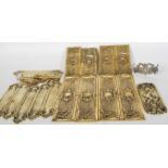 A collection of Victorian style brass door fitting / architectural plates and escutcheons of varying