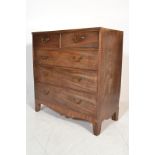 A 19th Century Georgian mahogany chest of drawers. The bank of two over three graduating drawers