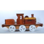 A 20th Century scratch built sit on steam engine train. Constructed using various wood samples and