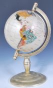 A 20th Century antique style desk top contrasting terrestrial globe constructed from polished semi