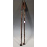A pair of 20th Century carved hardwood African tribal Ngoni ceremonial spears having carved