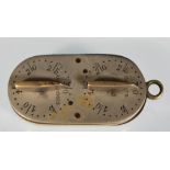 A 19th Century brass ' Norfolk Liar ' game counter / tally of ovular form having four twist dials