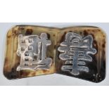 An early 20th Century antique Chinese tortoise shell belt buckle having two panels mounted with