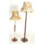 A retro 20th Century 1970's teak and brass floor standing lamp standard having a round teak