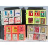 A collection of vintage 20th Century flat pack cigarette packets over four albums various brands