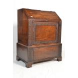 A 19th Century flame mahogany converted bureau cocktail cabinet conversion having a sloped hinged