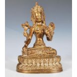 A finely decorated 20th Century Tibetan hollow cast brass Buddha having a floral engraved robe and