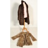A vintage 20th Century Musquash fur ladies 3/4 length coat with silk lined interior bearing original