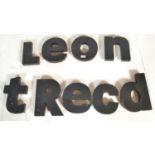 A collection of retro advertising letters, L,e,o,n,t,R,e,c,d, the letters being made up from a