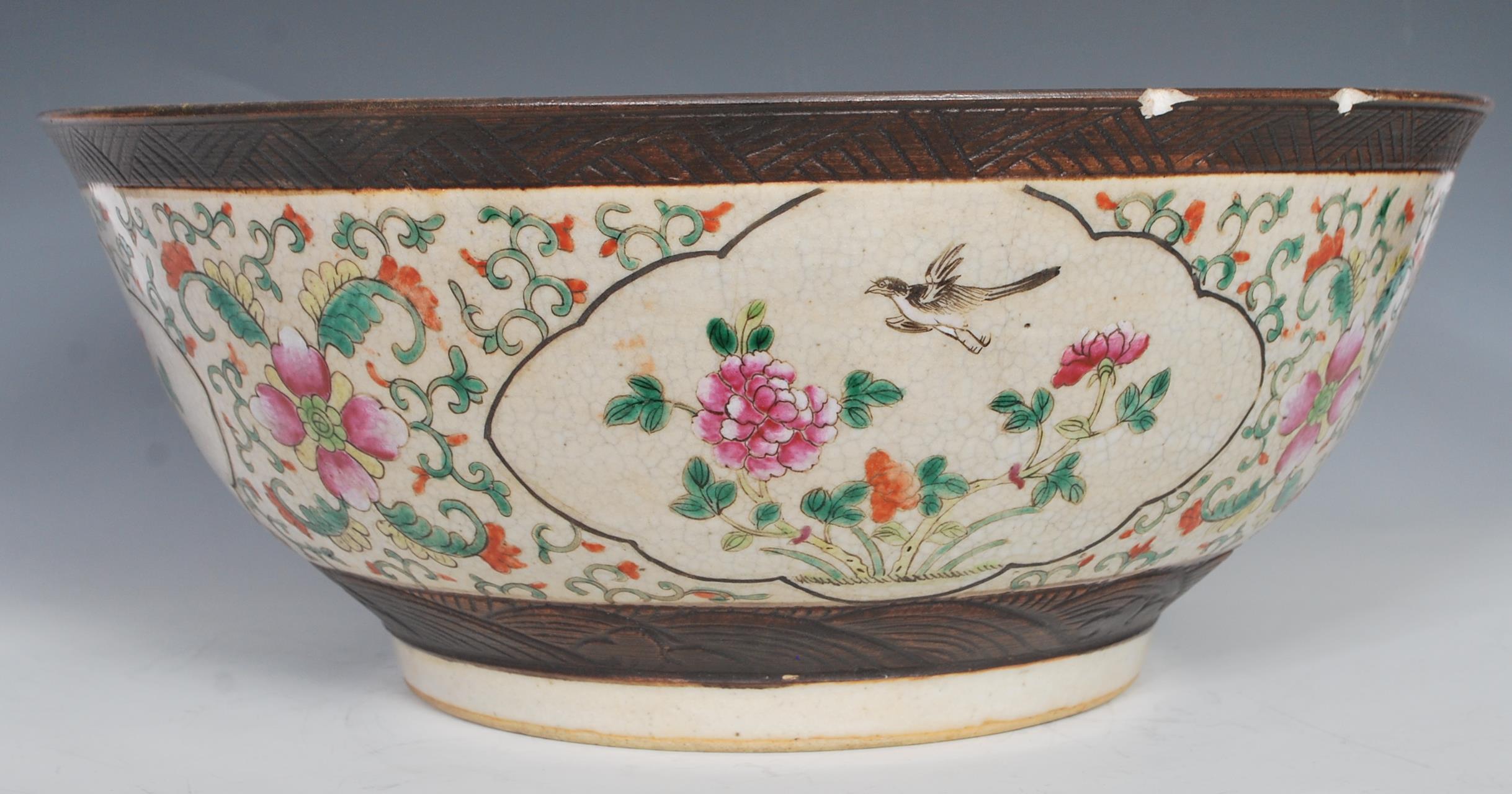 A large 19th Century Chinese crackle glazed pedestal punch bowl decorated with peony and bird in - Image 2 of 7