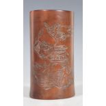 An early 20th Century Chinese bamboo brush pot of cylindrical form having a finely carved Oriental