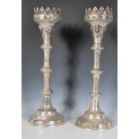 A pair of large 20th century gothic - ecclesiastical candlesticks having crown tops with prickers