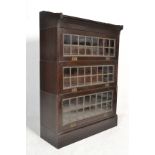 An early 20th Century mahogany Globe Wernicke type stacking bookcase having three cased tiers with