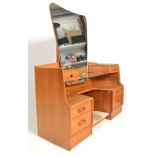 E. Gomme- G Plan- Brandon Range- A retro 1970's light oak dressing table having a large shaped