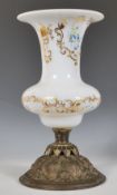 A 19th Century Victorian era milk glass centrepiece having a flared top and waisted neck raised on a
