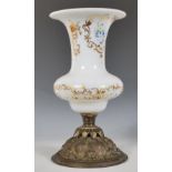 A 19th Century Victorian era milk glass centrepiece having a flared top and waisted neck raised on a