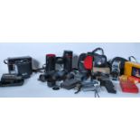 A collection of vintage cameras, film cameras, lens and accessories to include Kodak Brownie 127