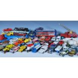 A collection of assorted play worn die cast toy model cars to include Corgi models Carrimore Car