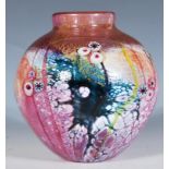 A Jonathan Harris studio art glass vase of bulbous form having a pink glass core with gold leaf