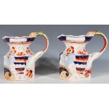 A pair of 10th Century Victorian Mason's lustre glazed hydra jugs of octagonal form with lions