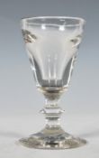 A early 19th Century Georgian cordial glass of round funnel form having a collar stem raised in a