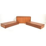 A retro mid 20th Century teak wood three piece suspended wall hanging unit consisting of a twin