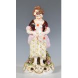 An early 20th Century Royal Crown Derby Stevenson and Hancock porcelain ceramic figurine in the form