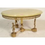A vintage 20th Century onyx topped circular coffee / occasional side table raised on a central