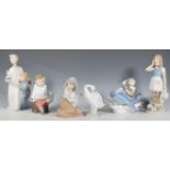 A collection of Lladro figurines to include 'Over the Clouds' depicting a boy in a blue plane (