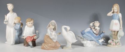 A collection of Lladro figurines to include 'Over the Clouds' depicting a boy in a blue plane (
