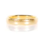 A hallmarked 22ct gold band ring of typical form. Hallmarked Birmingham 1924. Weight 3.9g. Size K.