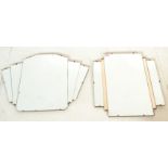 A pair of early 20th Century Art Deco bevelled edged wall mirrors. One mirror having a large central
