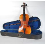 A 20th Century violin having two panelled back with ebony tuning pegs on a scrolled headstock and