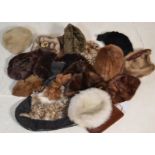 An assortment of vintage 20th Century fur hats of differing styles and sizes, with some bearing