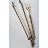 A 19th Century metamorphic / telescopic brass toasting fork having decorative embossed flower and