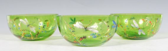 A set of three 19th Century Victorian hand blown green glass finger bowls each being hand