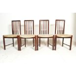 A set of four retro 20th Century Danish dark teak wood rail back dining chairs by Bolinge,